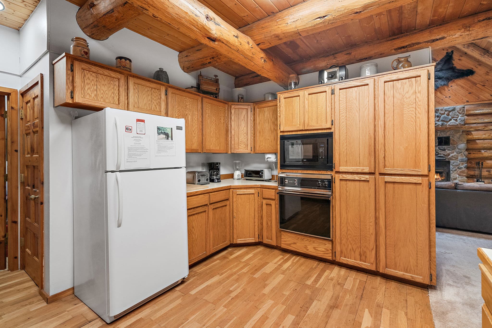 Kitchen with wall oven, microwave, toaster, and coffee maker.