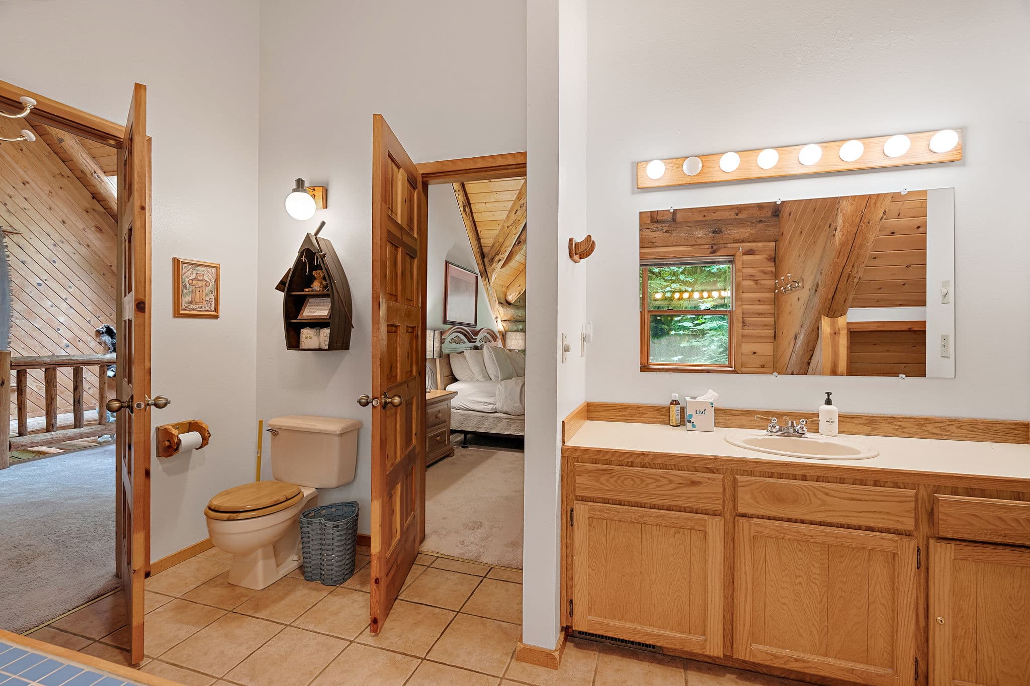 Upstairs bath with a long vanity, between the master and the loft.