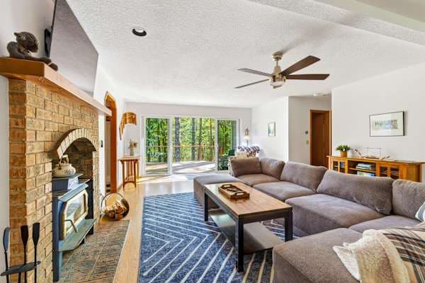 Living room with sectional and fireplace.