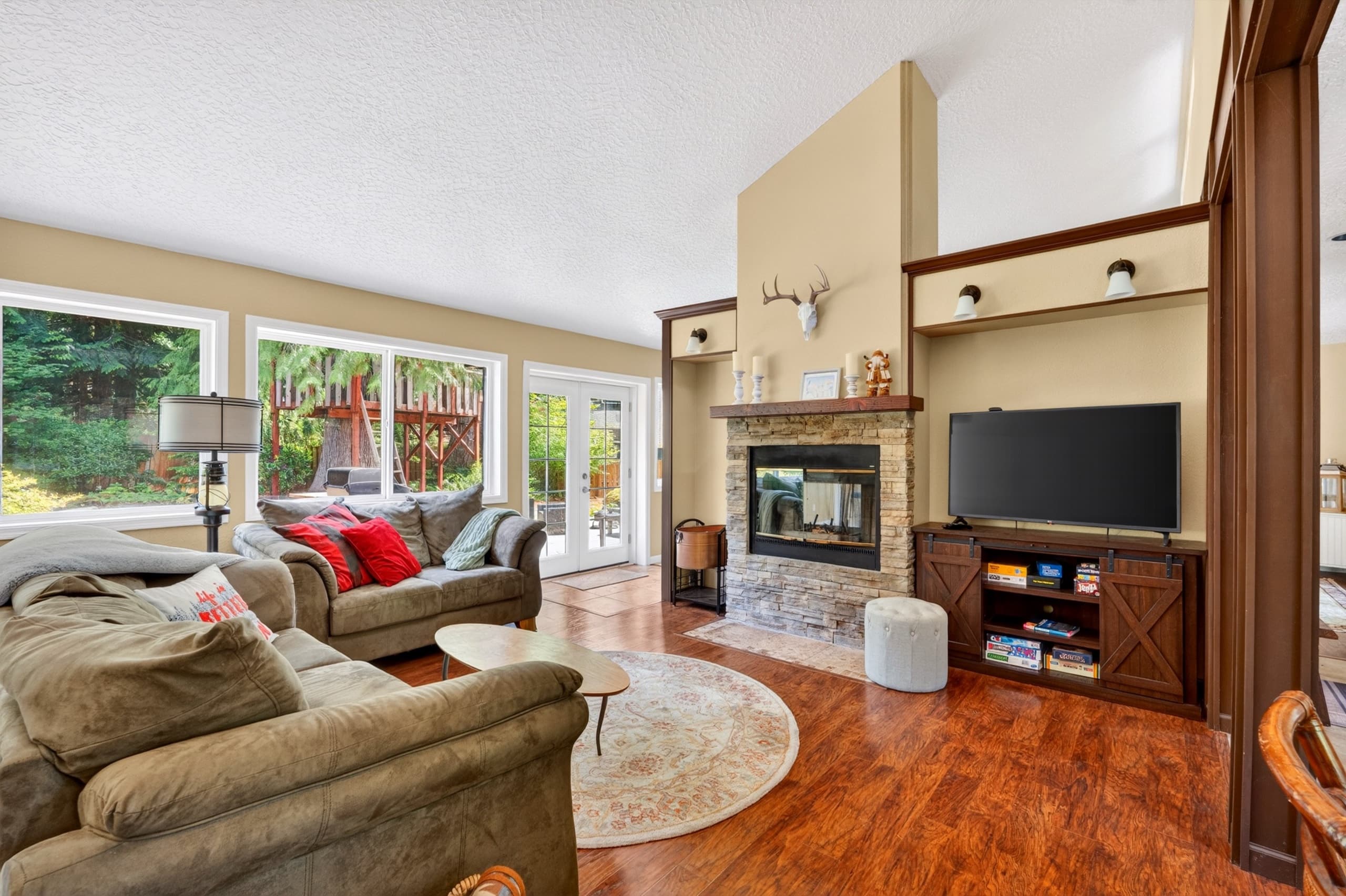 Living room with fireplace and TV.